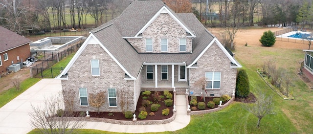 exterior space featuring brick siding, crawl space, a front yard, and central air condition unit