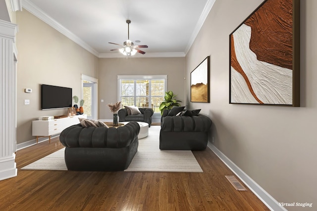 living area featuring dark wood-style floors, ornamental molding, visible vents, and baseboards