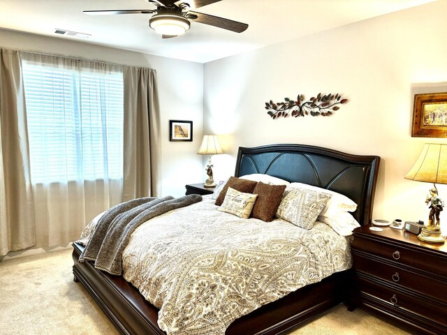 carpeted bedroom featuring ceiling fan