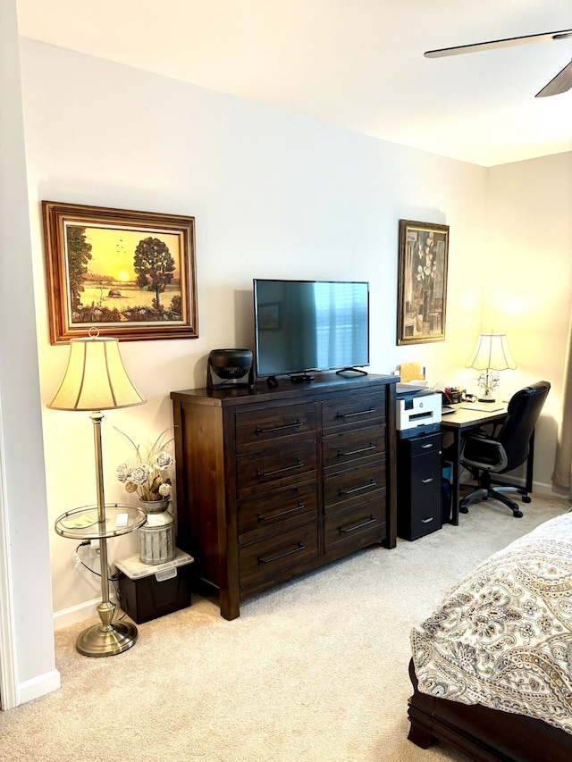 bedroom featuring ceiling fan and light colored carpet