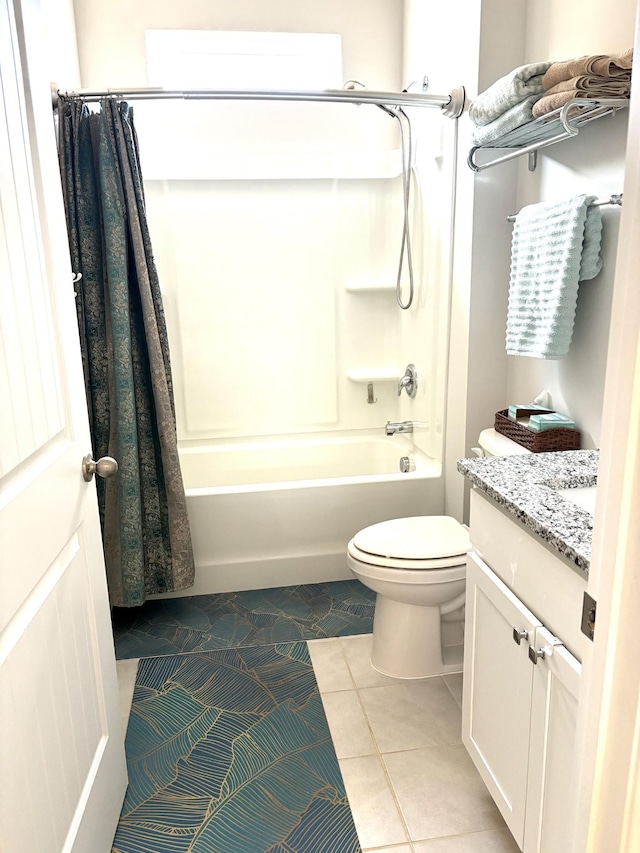 full bathroom with toilet, shower / bath combo, vanity, and tile patterned floors