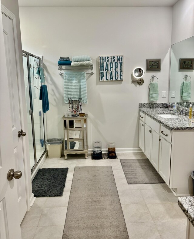 bathroom with vanity, tile patterned floors, and an enclosed shower