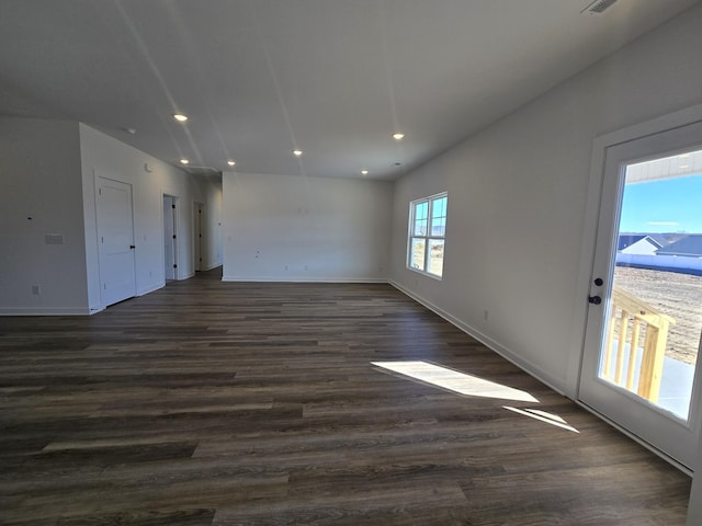 empty room with dark wood-type flooring