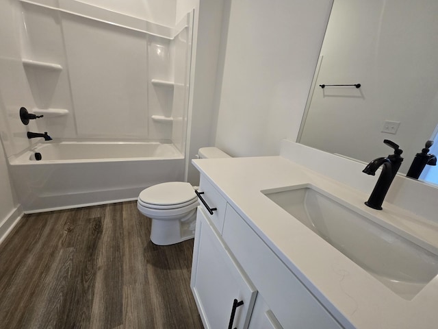 full bathroom featuring vanity, toilet, tub / shower combination, and hardwood / wood-style floors