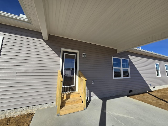 property entrance featuring a patio area