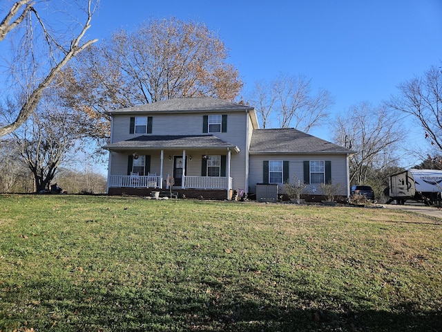 view of property featuring a porch and a front lawn