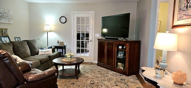 living room with a textured ceiling