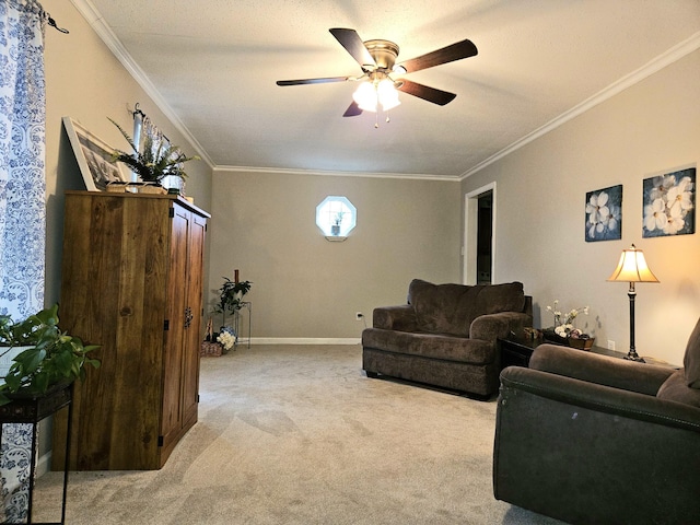 carpeted living room with ceiling fan and ornamental molding