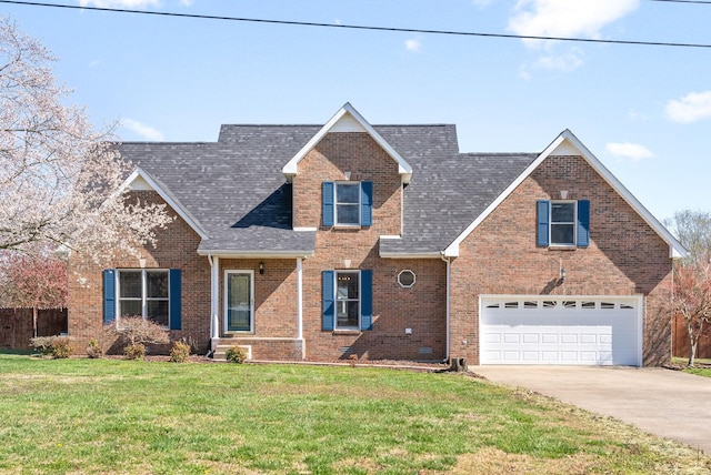 view of front of home featuring a garage and a front lawn