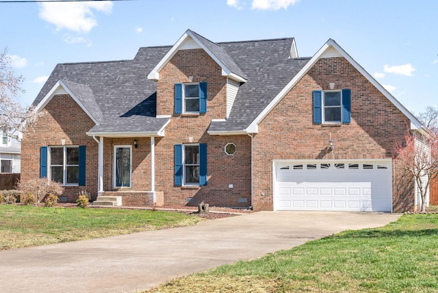 view of front of property with a garage and a front yard