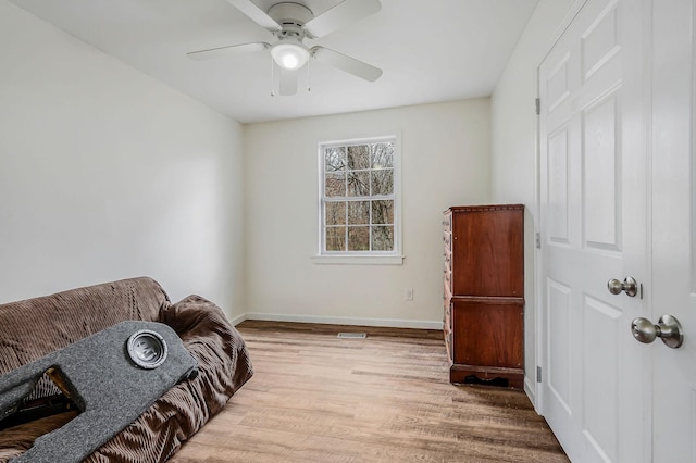 sitting room featuring ceiling fan and light hardwood / wood-style floors