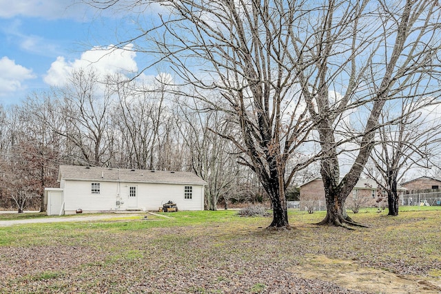 view of side of home featuring a lawn