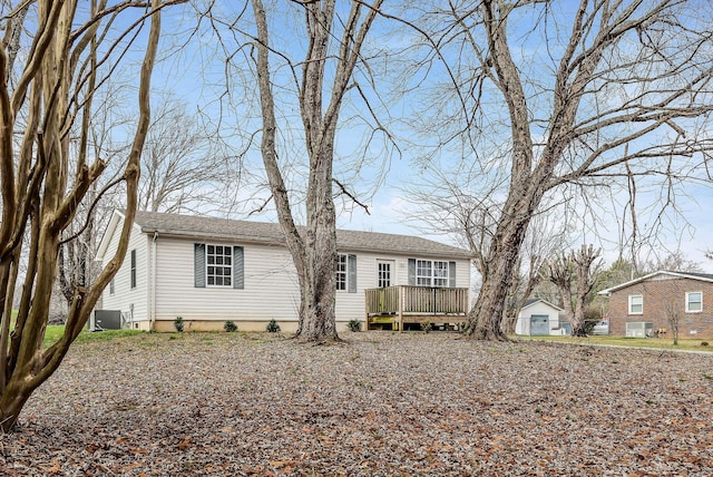 view of front of house with a deck and central AC unit