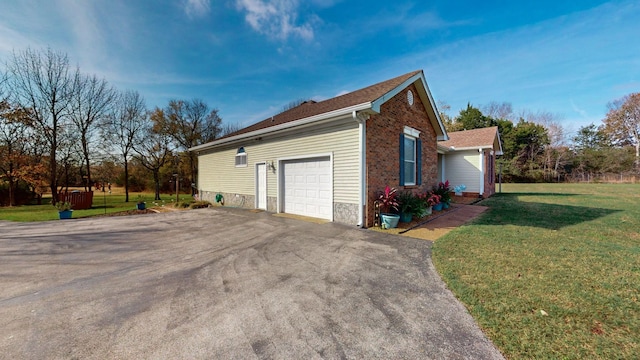 view of property exterior with a yard and a garage