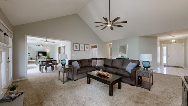 living room featuring light carpet, high vaulted ceiling, and ceiling fan