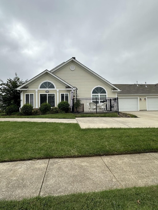 ranch-style house with a garage and a front yard