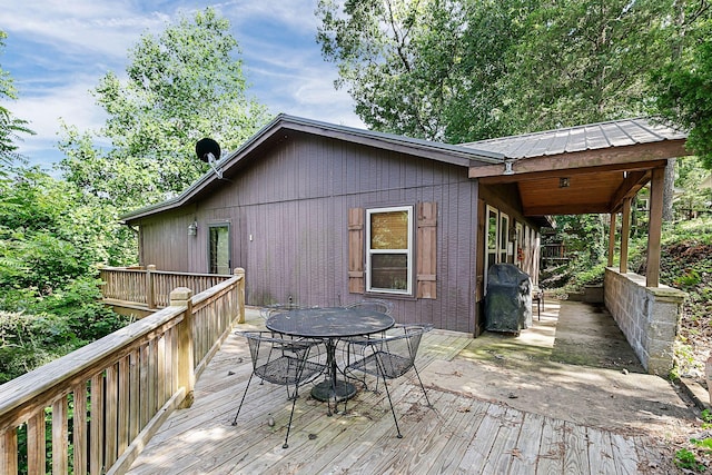 wooden deck with a grill