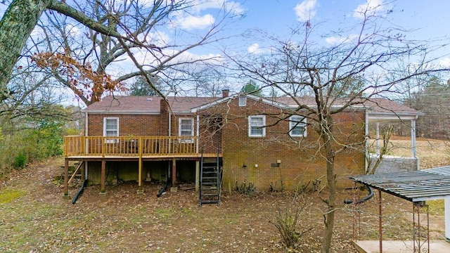 back of property featuring a wooden deck