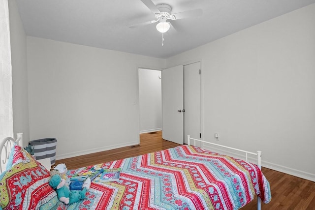 bedroom featuring ceiling fan and wood-type flooring