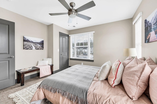 bedroom with ceiling fan and light colored carpet