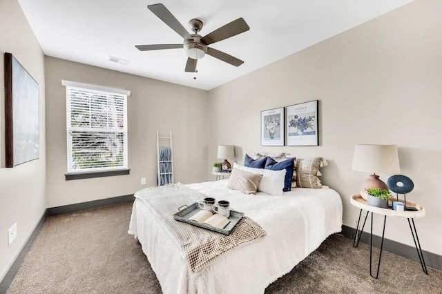 bedroom with dark carpet and ceiling fan