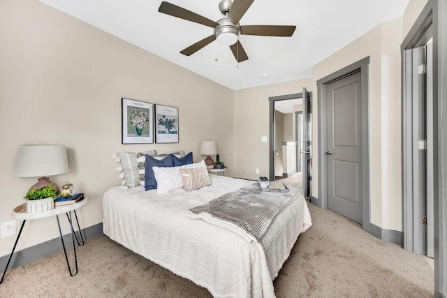 carpeted bedroom featuring ceiling fan