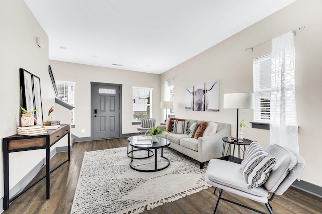 living room featuring dark hardwood / wood-style floors