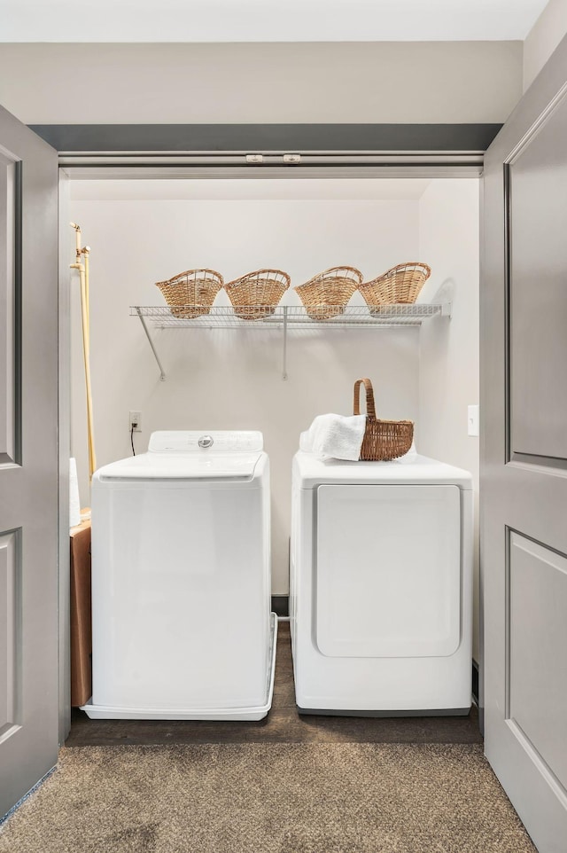 laundry area with washing machine and clothes dryer