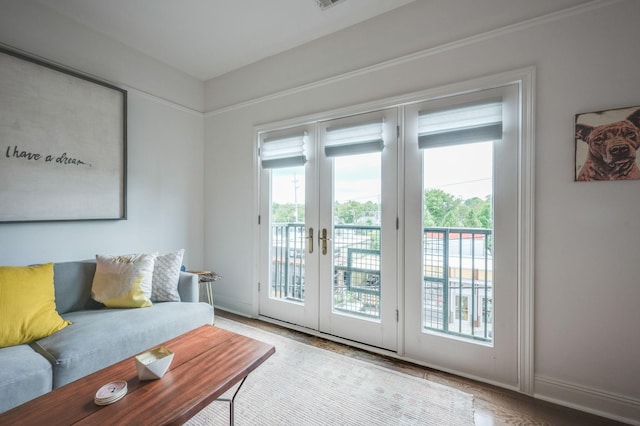 doorway with french doors and light hardwood / wood-style floors