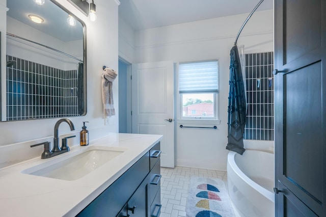 bathroom with vanity and shower / tub combo with curtain