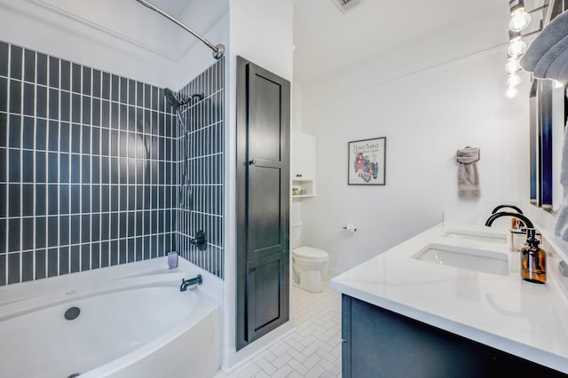 full bathroom with vanity, toilet, and tiled shower / bath