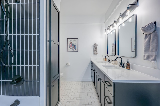 bathroom with tile patterned floors, vanity, and toilet