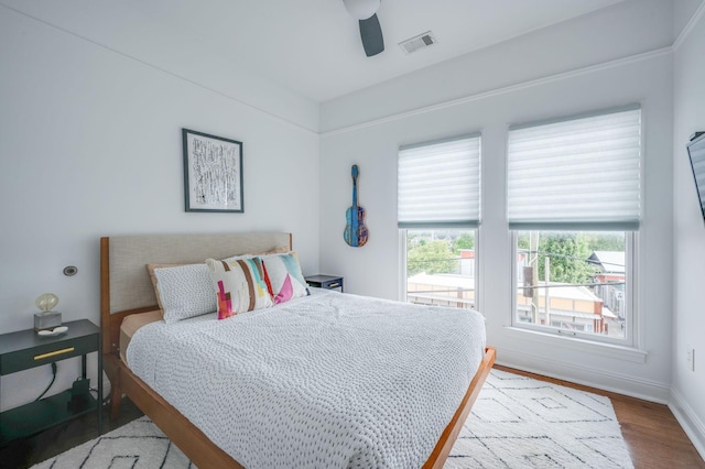 bedroom featuring hardwood / wood-style floors and ceiling fan