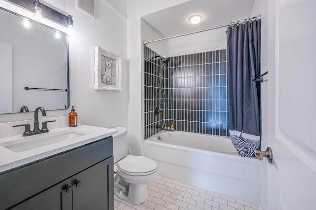 full bathroom featuring toilet, shower / bath combo with shower curtain, vanity, and tile patterned flooring