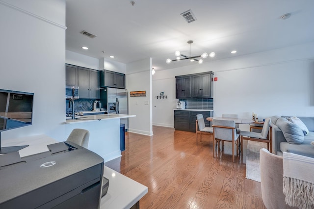 interior space with light hardwood / wood-style flooring and a chandelier