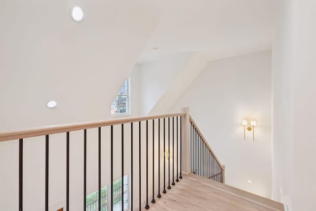 stairs featuring recessed lighting and lofted ceiling