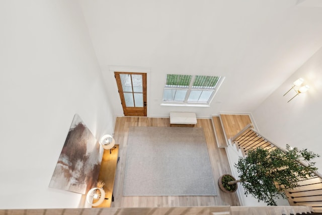 entryway with stairway and wood finished floors