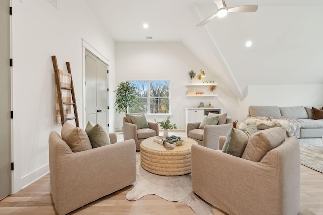 living area with recessed lighting, ceiling fan, light wood-style floors, and vaulted ceiling