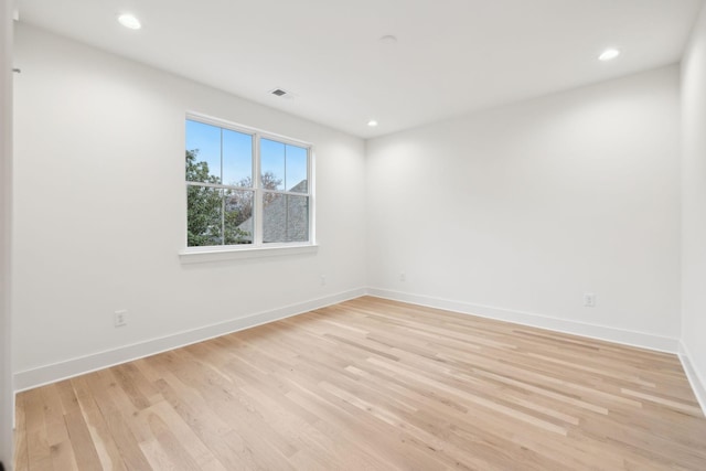 empty room featuring recessed lighting, visible vents, baseboards, and light wood-style flooring