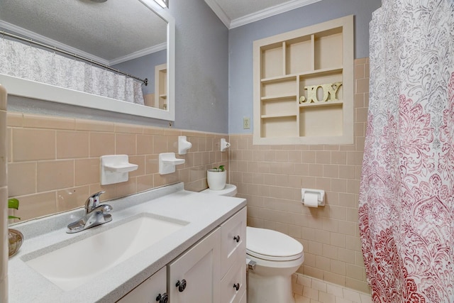 full bathroom with ornamental molding, tile patterned floors, a textured ceiling, vanity, and tile walls