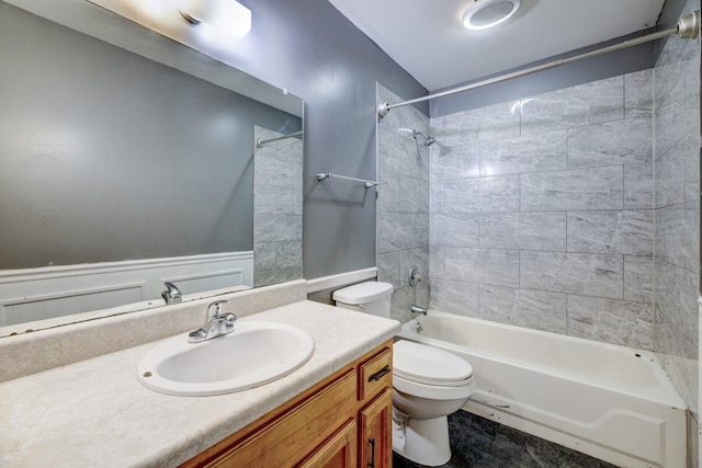 bathroom featuring wainscoting, shower / bath combination, vanity, and toilet