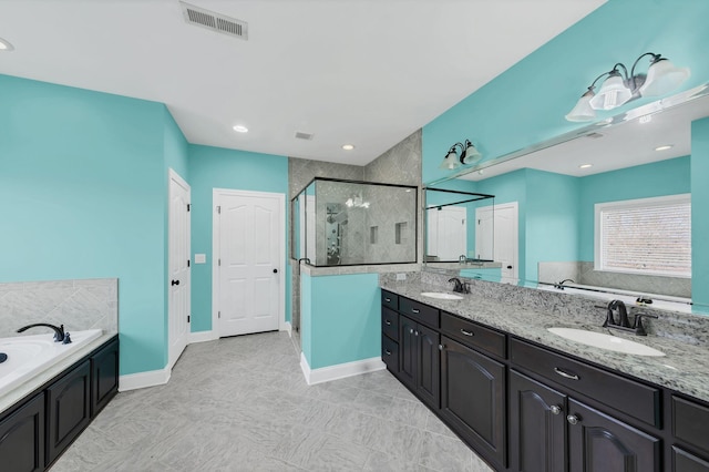 bathroom featuring vanity and plus walk in shower