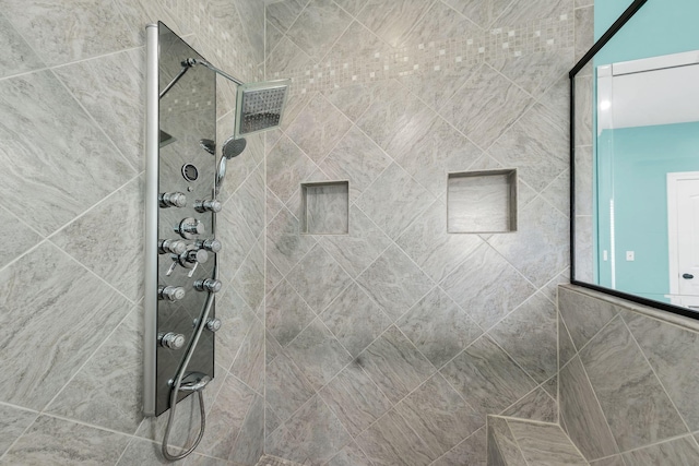 bathroom featuring tiled shower