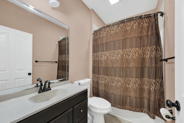 bathroom with a shower with curtain, tile patterned flooring, vanity, and toilet