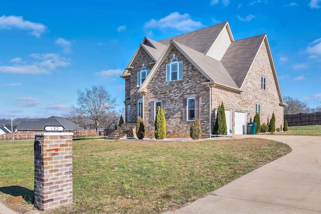 view of front facade with a front lawn and a garage