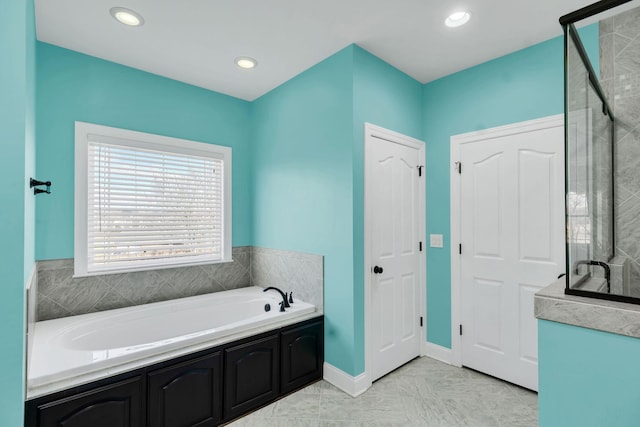 bathroom with tile patterned flooring and separate shower and tub