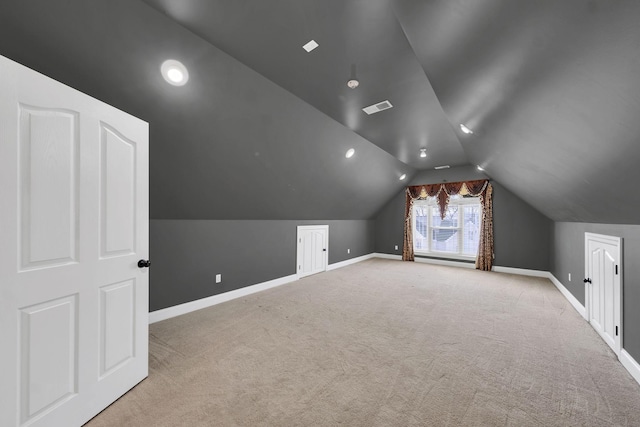 bonus room featuring light colored carpet and vaulted ceiling