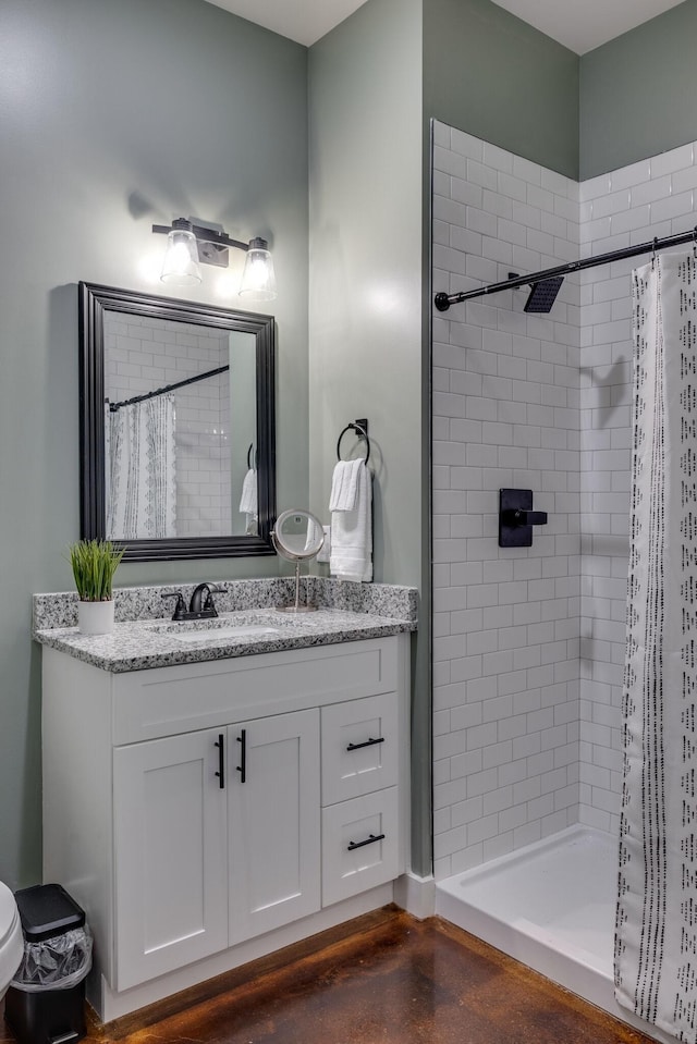 bathroom featuring vanity and a shower with shower curtain