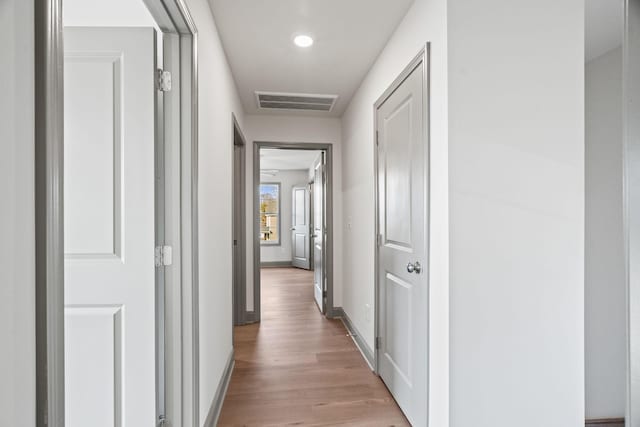 hall with light hardwood / wood-style floors