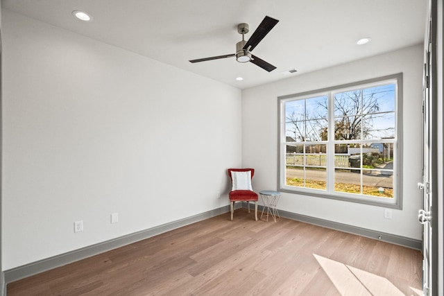 unfurnished room featuring ceiling fan and light hardwood / wood-style floors